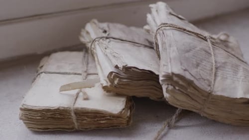 Stacks of Old Paper Bundled with Twine