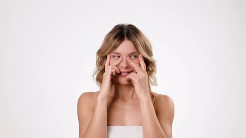 Woman Gently Massaging and Tapping Under Eye Area
