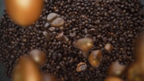Coffee Beans Being Held and then Poured