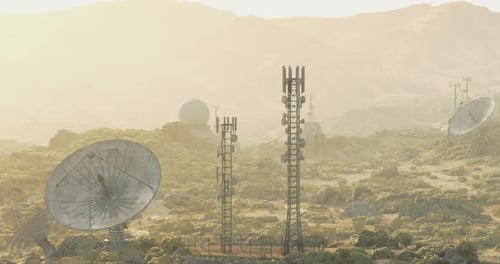 Modern Communication Towers and Satellite Dishes in Desert Landscape