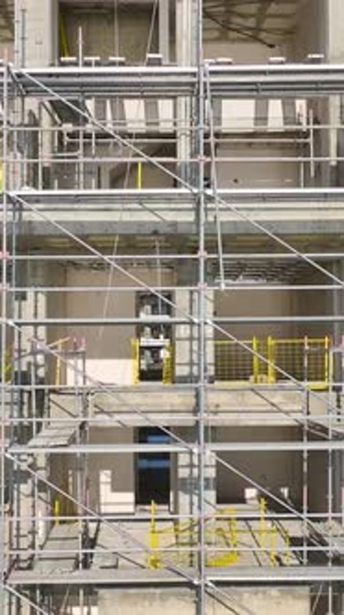 Vertical Video of an IndustrialStyle Building Frame Standing Tall Ready for the Next Phase of