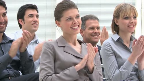 Business People Clapping at a Corporate Event