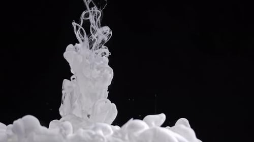 White Fluid Paint Descending into Water