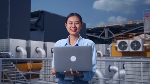 Asia Female Use Laptop And Smiling On Rooftop HVAC