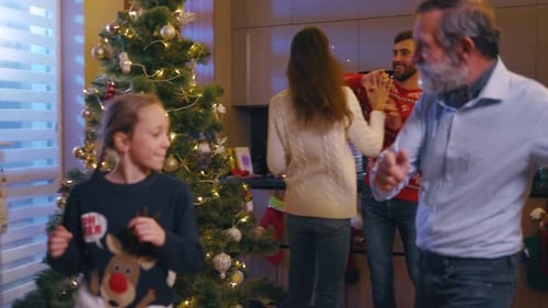 Family Dancing and Celebrating Christmas at Home