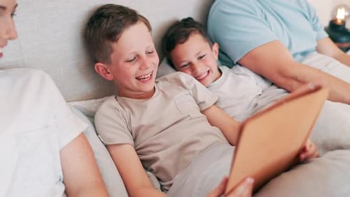 Family Togetherness at Home Reading and Laughing