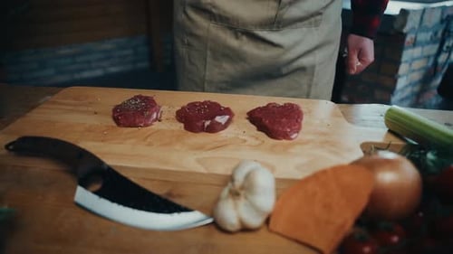 Seasoned Meat Being Prepared for Cooking