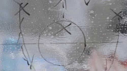 Close Up Vertical Video of Football Playbook Instruction and Advice Drawn on Glass