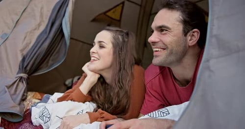 Happy Couple Relaxing Inside Tent While Camping