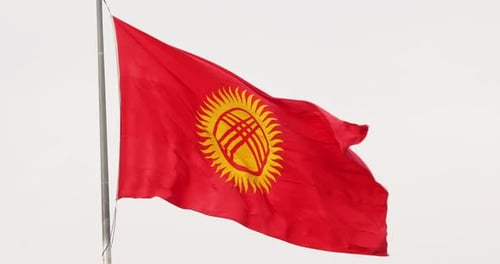 Flag of Kyrgyzstan Waving in the Wind