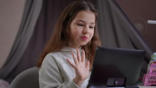 Girl Using Tablet for Video Call at Home