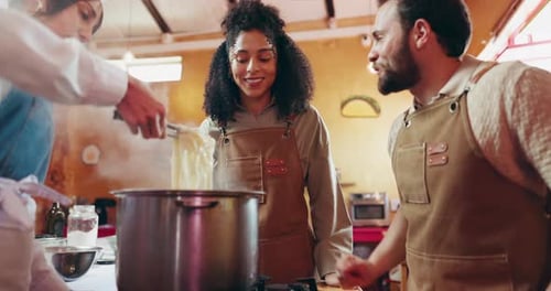 Couple, chef and cooking class with ingredients, teaching and learning with pasta meal