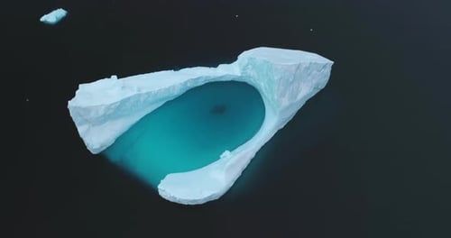 Pristine Iceberg Floating in Arctic Ocean Aerial