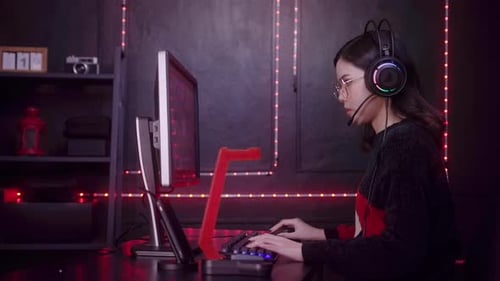Woman Gamer Putting on Headset to Play
