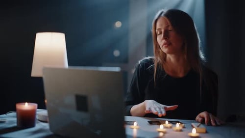 Mystical Woman Reading Tarot Cards Online at Night