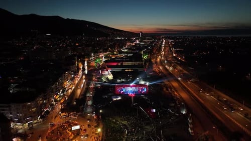 City at Night: Aerial View of Outdoor Concert