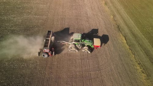 Tractor on the field seeding wheat