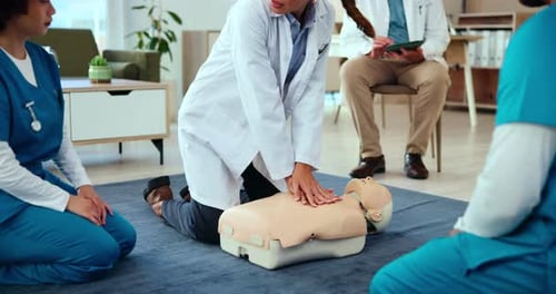 First aid, training and doctor with cpr on dummy for cardiac arrest, emergency healthcare