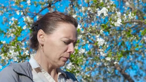 Sneezing in Park During Spring Allergy