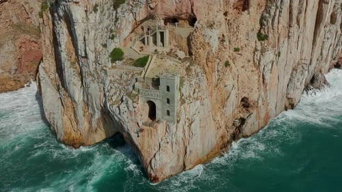 Porto Flavia: close-up aerial view of the old mining port on the island of Sardinia.
