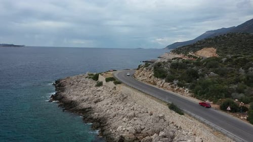 Drone view of beautiful serpentine road along the Aegean sea coast