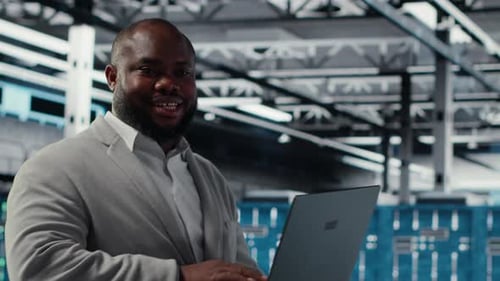 Server Room Engineer Deploying New Builds to Improve Uptime Using Software