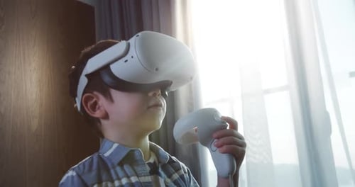 Boy Immersed in Virtual Reality Gaming Experience