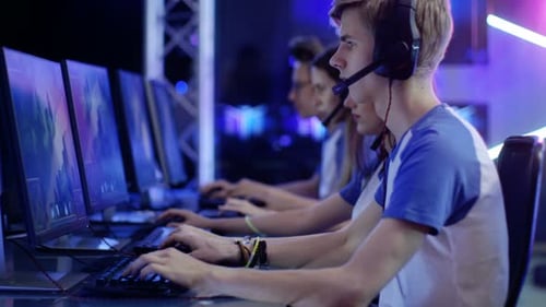 Intense Young Adults Play Video Games in Tournament