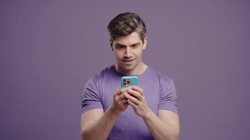 Surprised Man With Smartphone On Violet Guy Using Social Networks Sales Joy