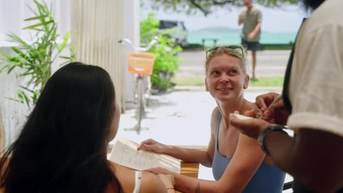 Women Dining at Tropical Open-Air Cafe