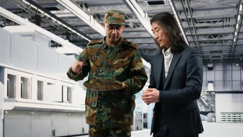 Soldier and Engineer in Microchip Factory Increase Semiconductor Production