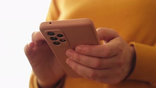 Person Using Mobile Phone Close Up