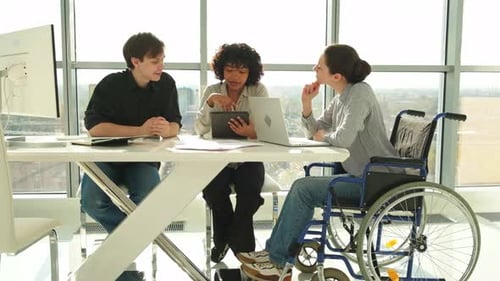 Inclusive Office Team Working at Table