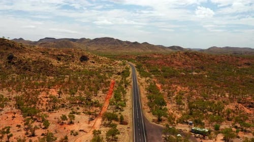 Empty Road Among Hills And Bushes At Northern Territory Region, Outback Australia. - Aerial