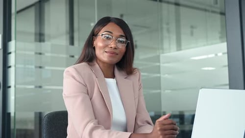 Young Happy Professional Business Woman Manager Sits at Office Desk Portrait