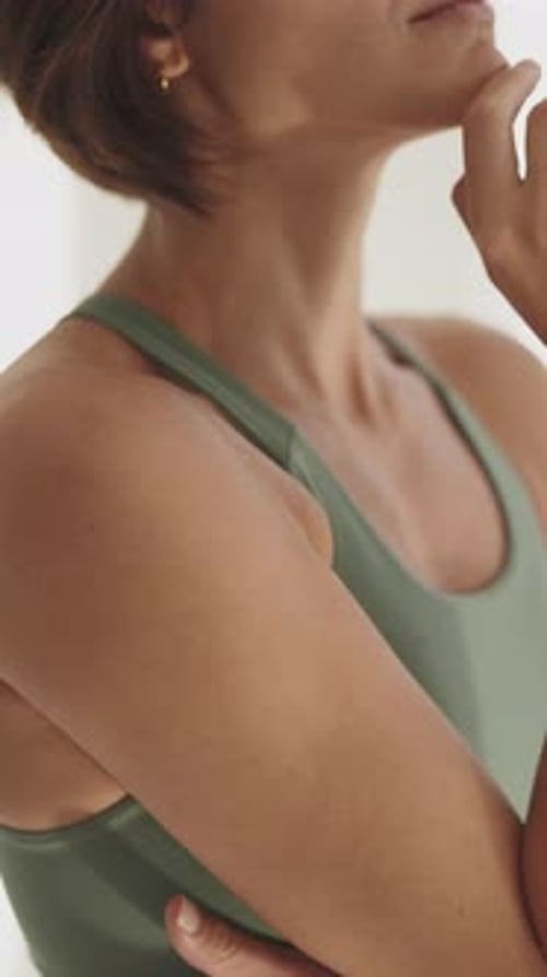 Closeup of Woman in Green Activewear Doing Yoga Pose