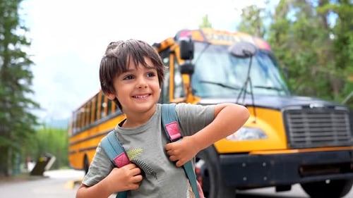 Happy child ready for school bus trip