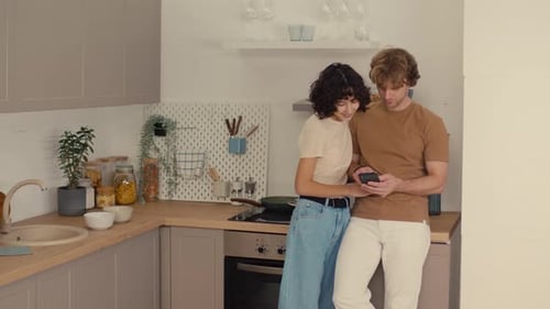 Young Couple Sharing a Moment in Kitchen
