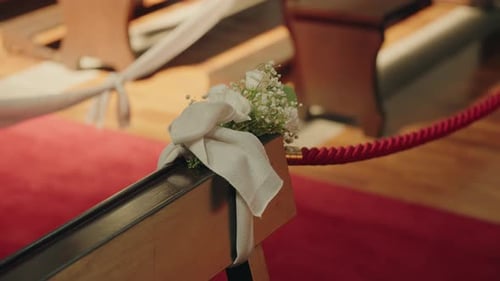 Elegant Floral Pew Decoration for a Wedding Ceremony