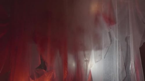 Dark Room Covered in Plastic with Red Splatter