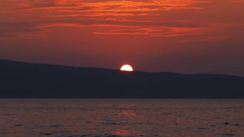 Red Sunset Over the Ocean Water