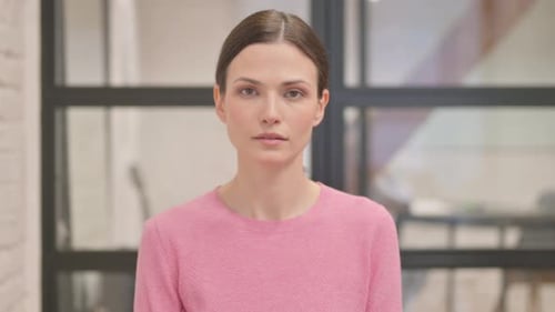 Portrait of Serious Young Woman in Office