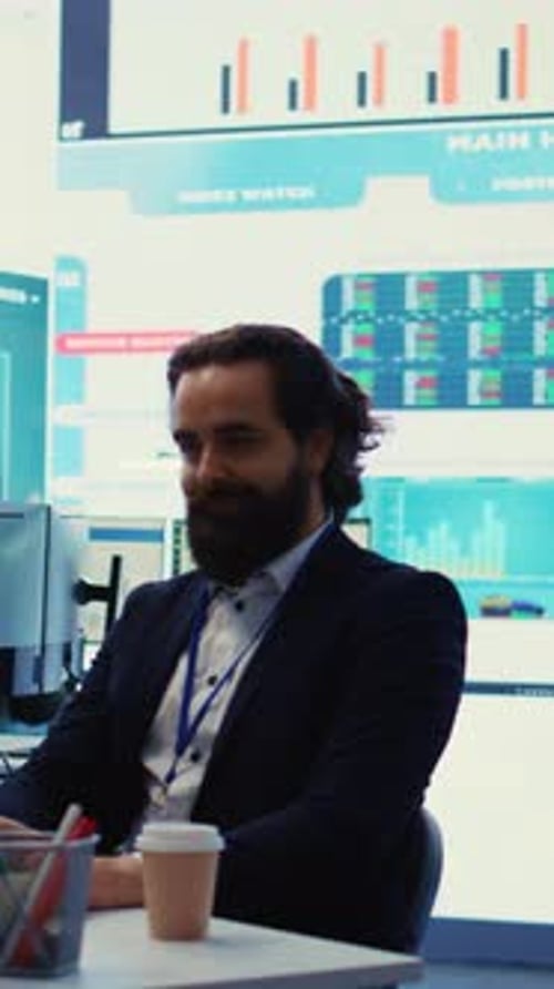 Vertical Video General Manager Working on Data Management with Infographics