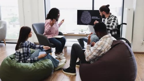 Team Collaboration on Artificial Intelligence Project in Modern Office Setting