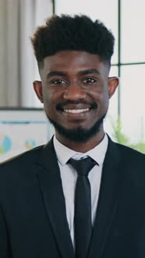 Young Man Smiling in a Business Suit