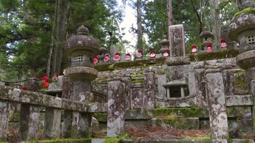Slow motion slider over temple grounds at Mt. Koya with Jizo Statue