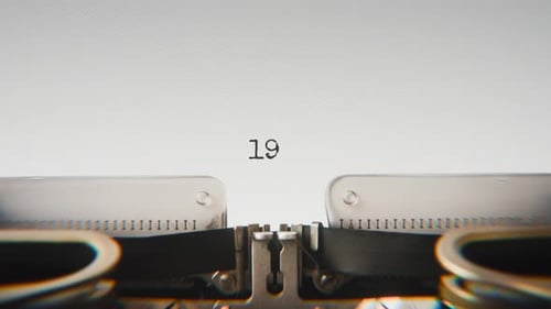Old mechanical typewriter typing Year 1995 in a close-up view.