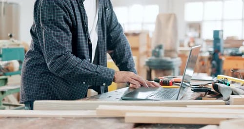 Designer, hands and carpenter with laptop in workshop manufacturing or engineering project
