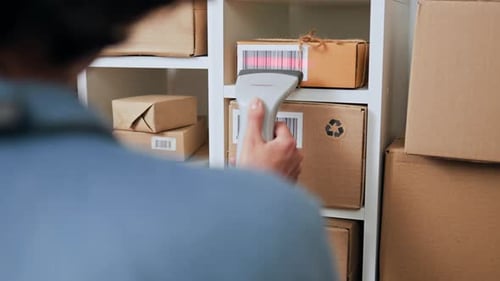 The Process Of Scanning Cargo Parcels Using A Barcode Scanner The Red Beam Scanner, A Medium Sized