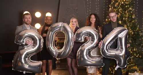Friends Celebrate New Year Holding 2024 Balloons